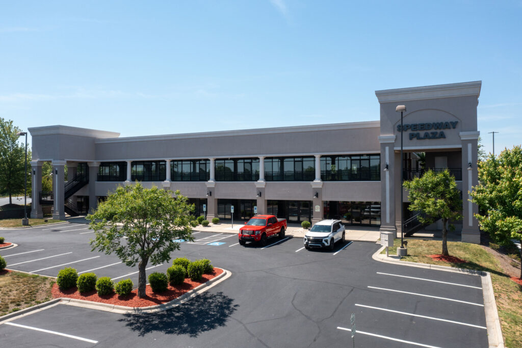 Speedway Plaza building exterior and parking lot